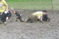 grubbyfacekid grubby face activities swamp-soccer people sliopping falling in a muddy field