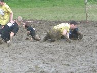 grubbyfacekid grubby face activities swamp-soccer people sliopping falling in a muddy field